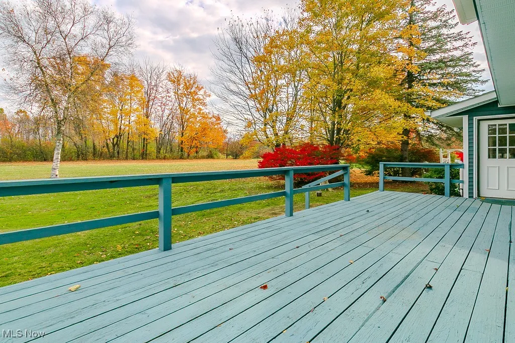 Deck featuring a yard