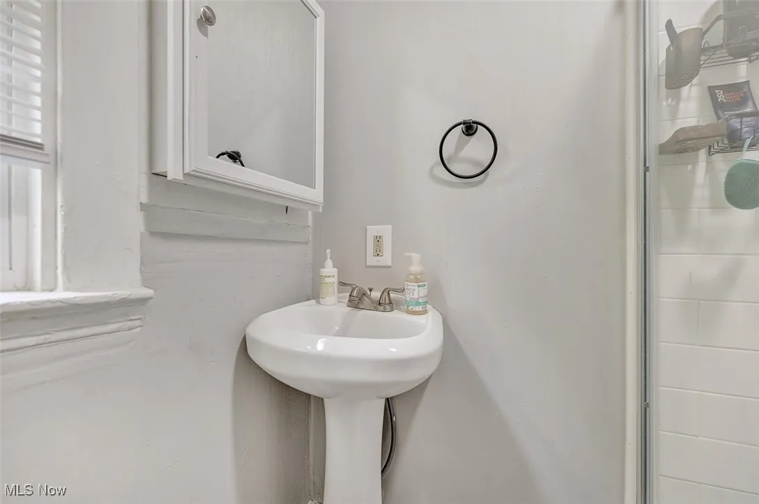 Full bathroom with a stall shower