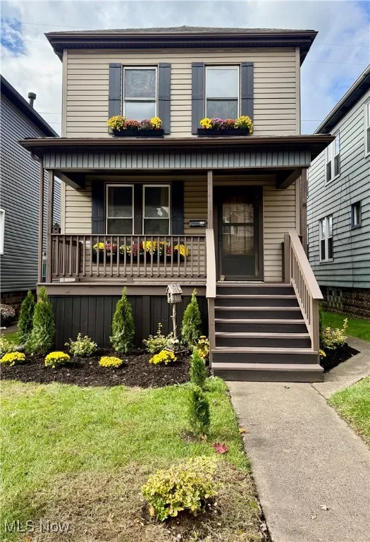 Traditional style home featuring covered porch