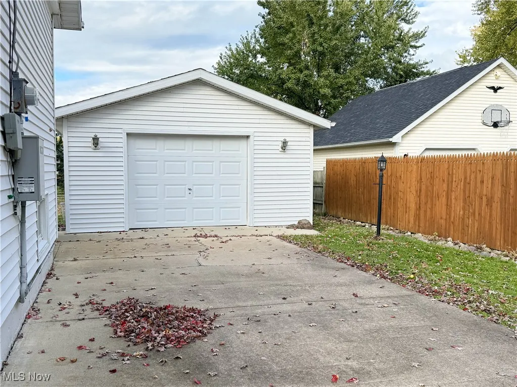Detached garage featuring driveway
