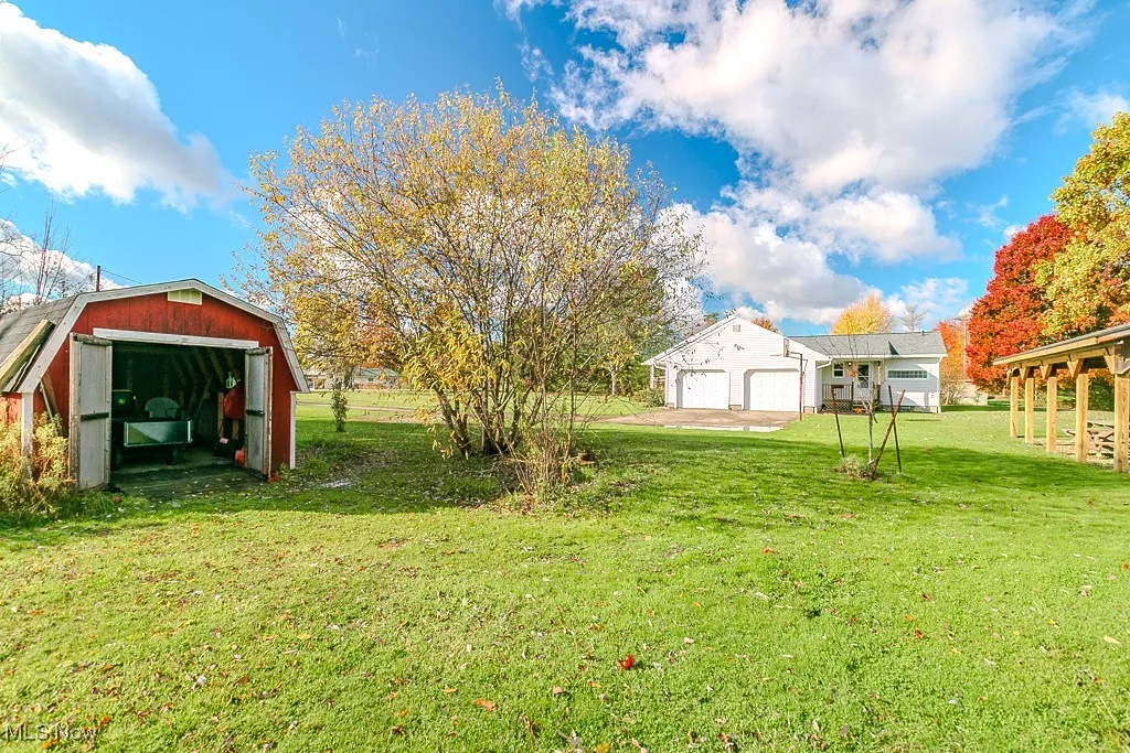 Shed for mower and tool storage.