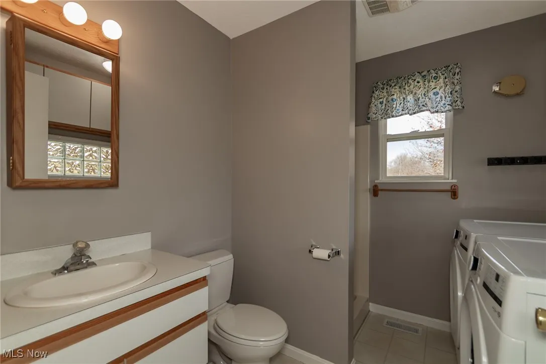 Full bath with shower and laundry.