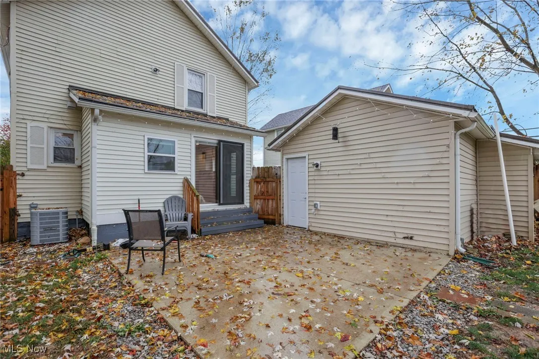 Rear view of property with a patio and entry steps
