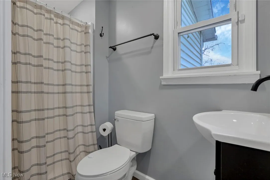 Full bathroom featuring vanity and a shower with curtain