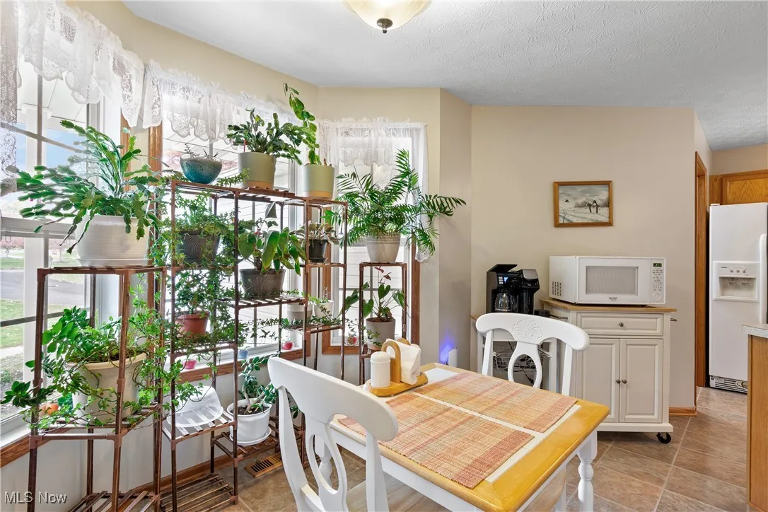 Dining space featuring a textured ceiling