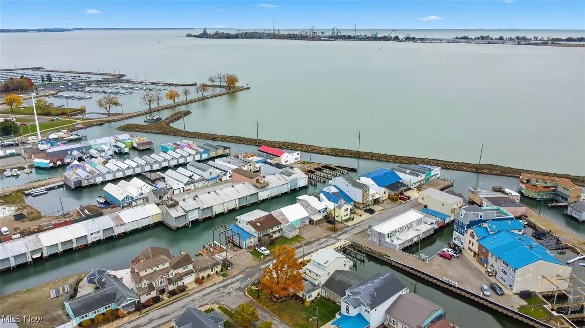 Drone / aerial view of a nearby body of water and numerous boat docks