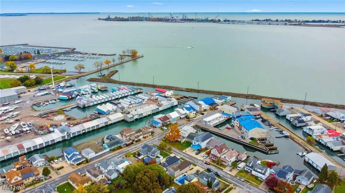 Drone / aerial view of a large body of water and a marina