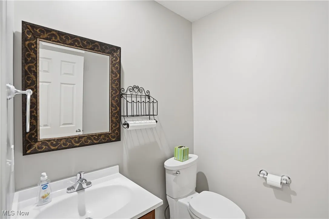 Half bath with vanity and toilet