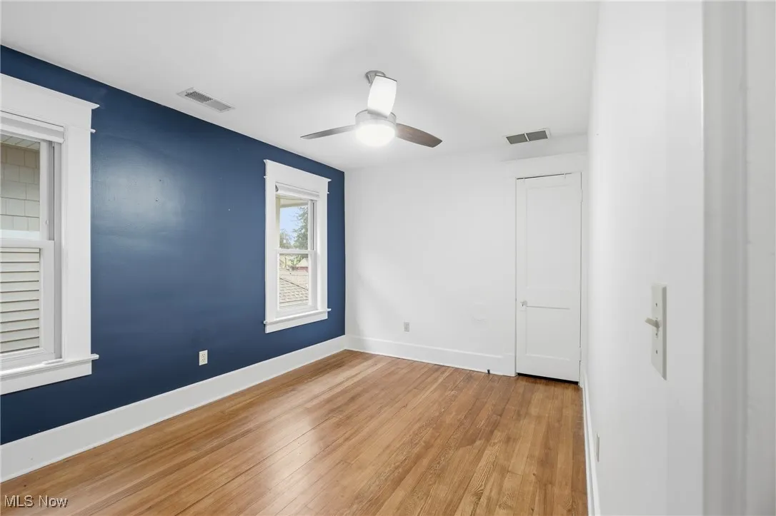 Spare room with light wood-style floors and ceiling fan