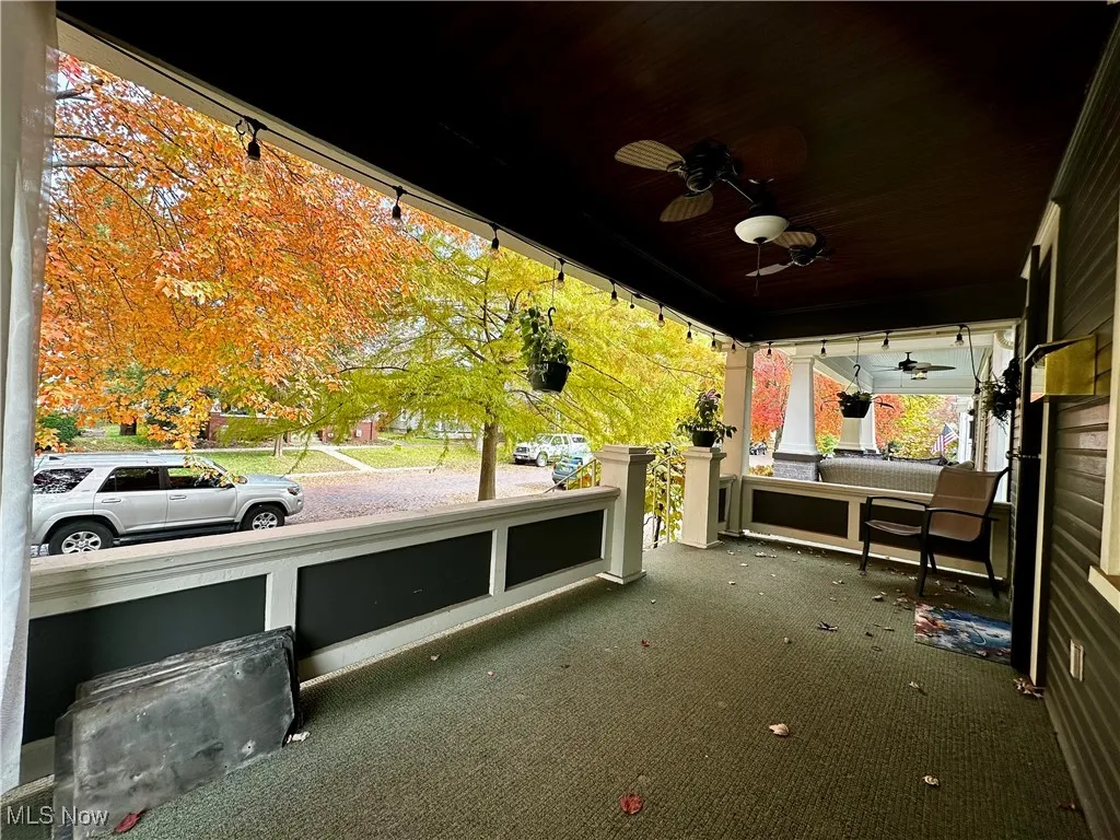 View of patio with ceiling fans and an outdoor hangout area