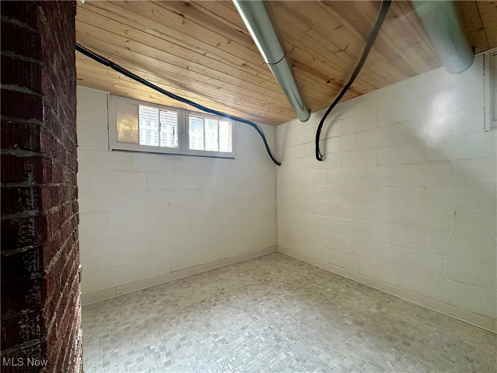 Basement featuring tile patterned floors