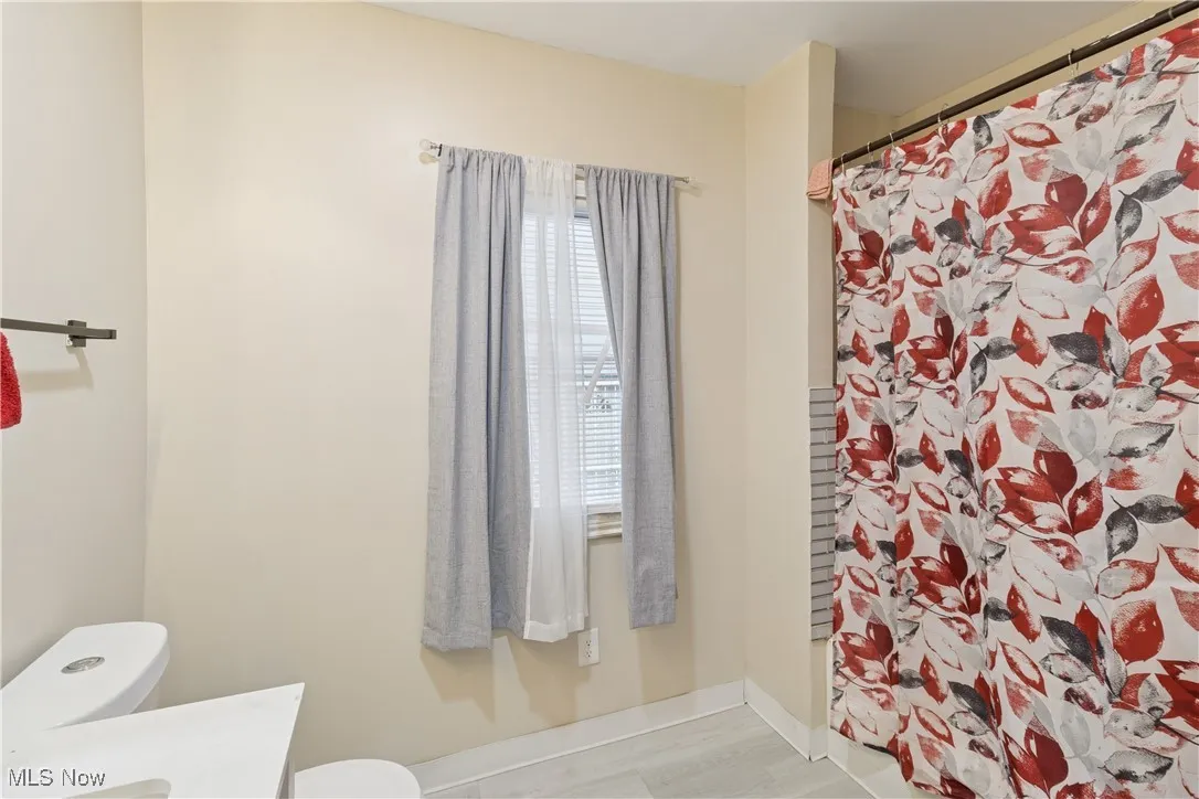 Full bath featuring toilet and vanity