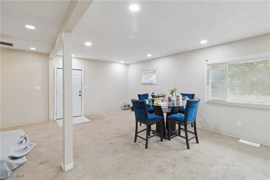 Dining room featuring light carpet and recessed lighting