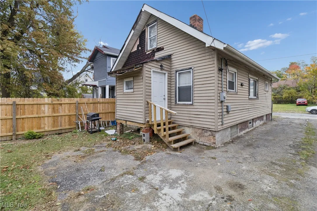 Rear view of house with a chimney