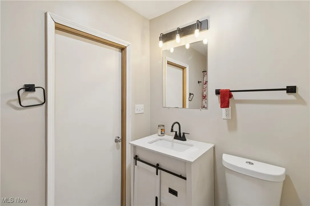 Bathroom with vanity and toilet