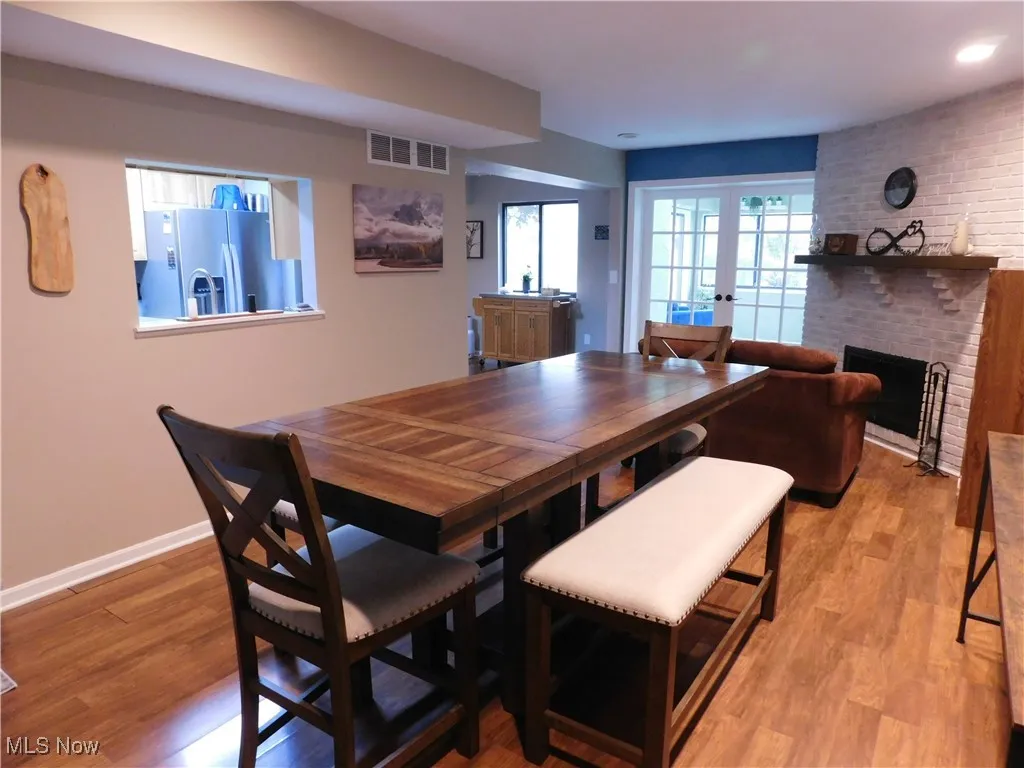 Dining space opens to french doors leading to Sunroom