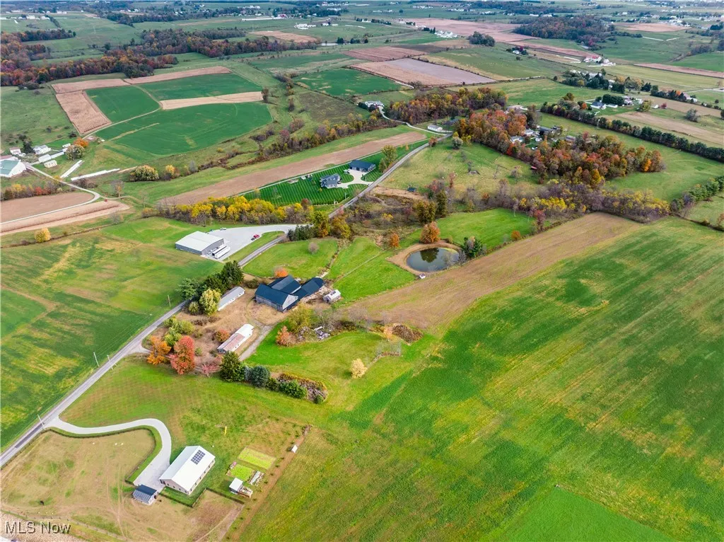 Aerial overview of property's location with rural landscape and extensive farmland