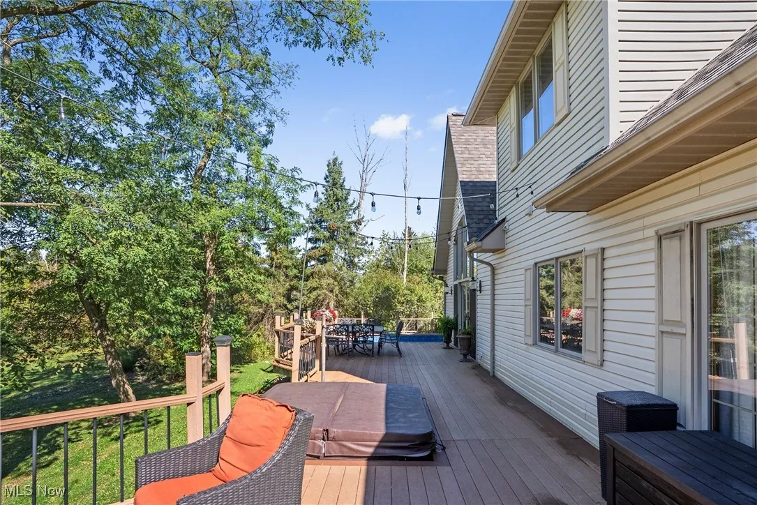 Wooden terrace featuring outdoor dining area