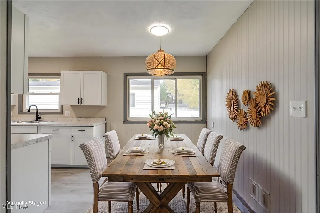 Dining area featuring healthy amount of natural light and light wood-style floors