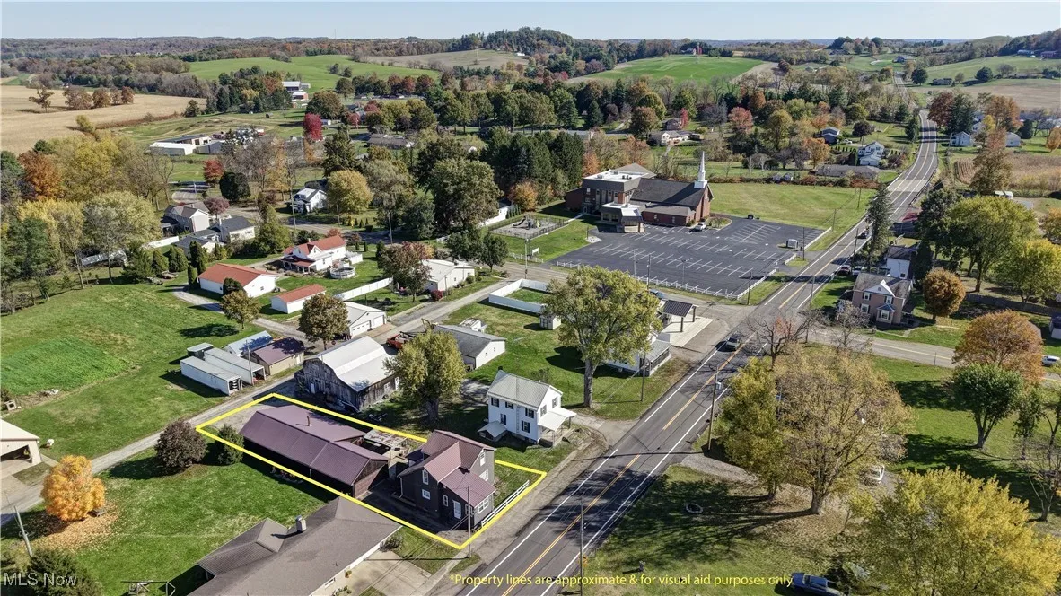 Aerial view of residential area with property parcel outlined