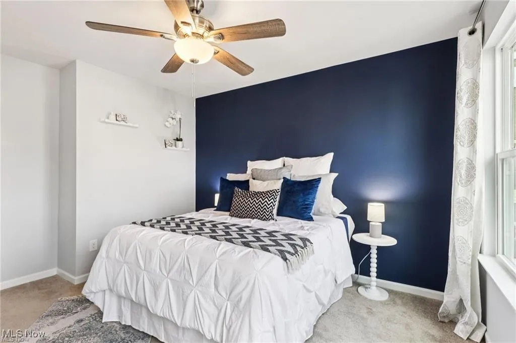 Bedroom with carpet flooring and ceiling fan