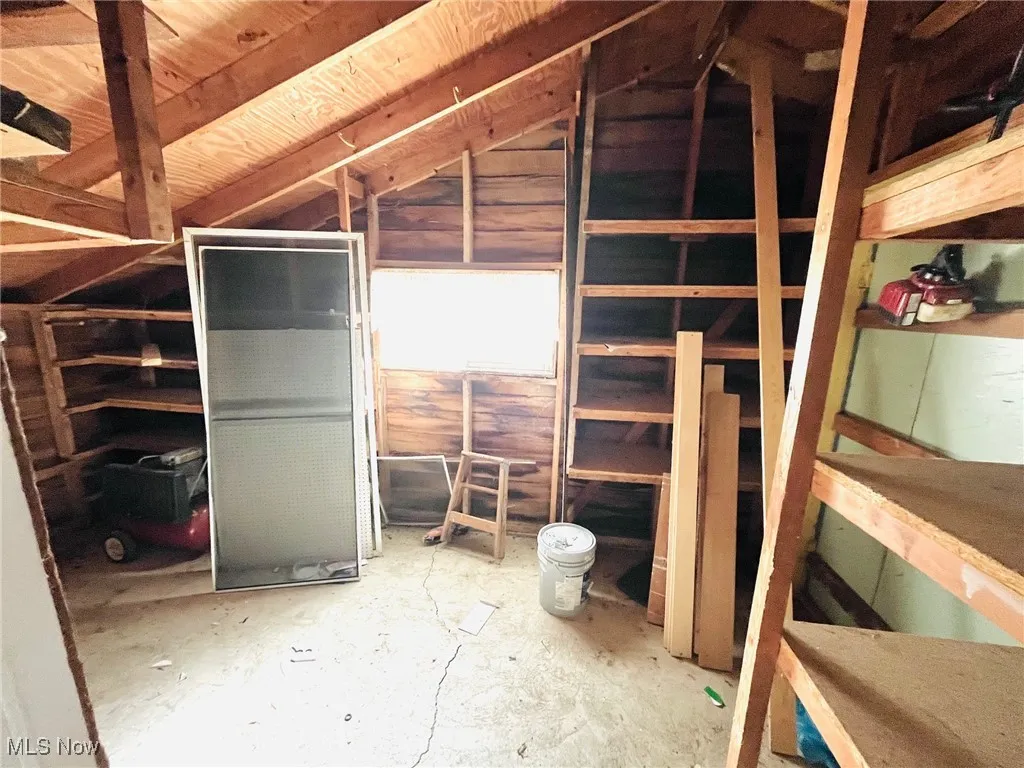 View of storage room attached to garage