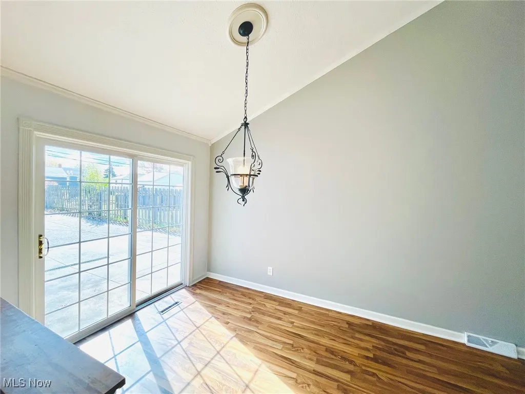 Dining room with chandelier and slider to back yard