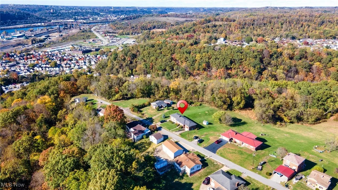 View of property location with nearby suburban area