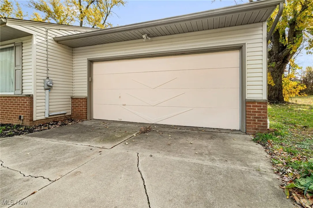 Garage featuring driveway