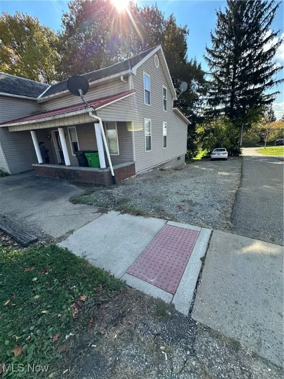 View of property exterior with a porch