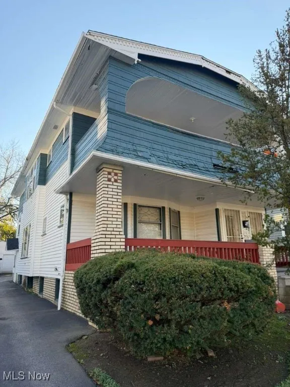 View of home's exterior with a balcony