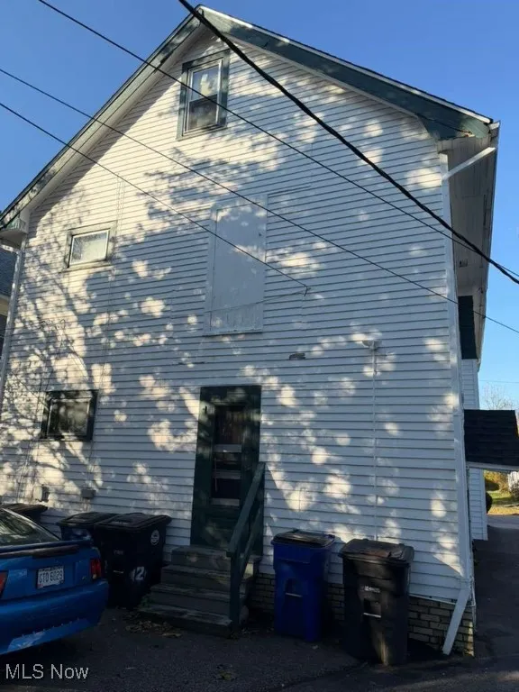 View of home's exterior featuring back entry steps