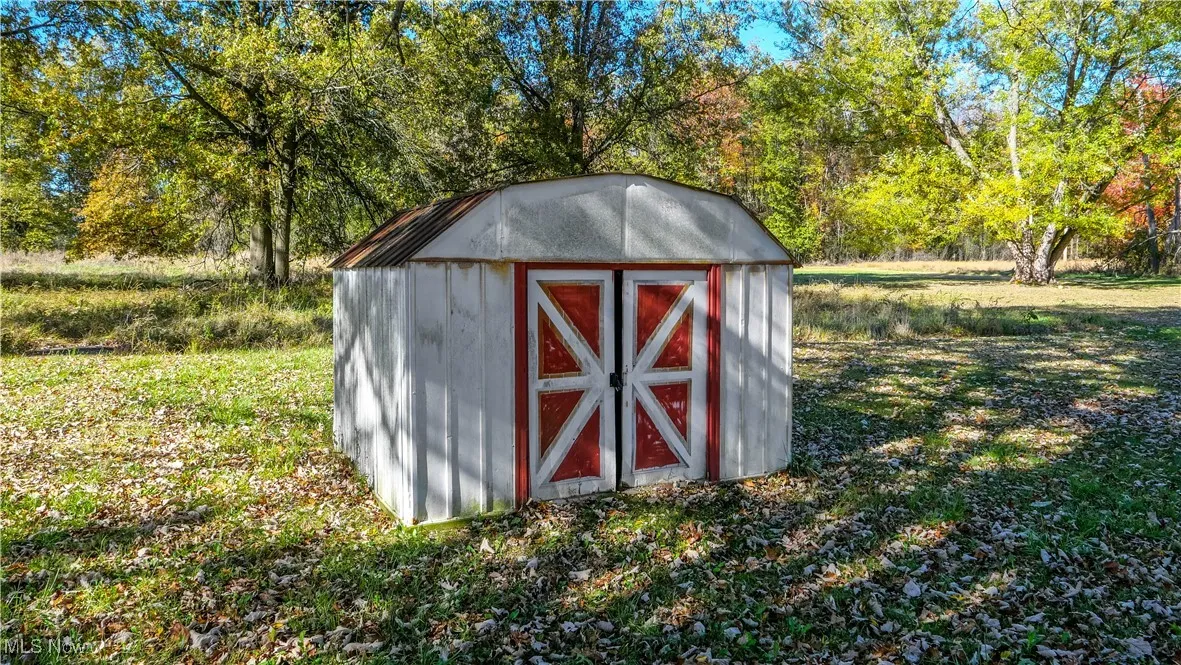 View of shed with view of scattered trees