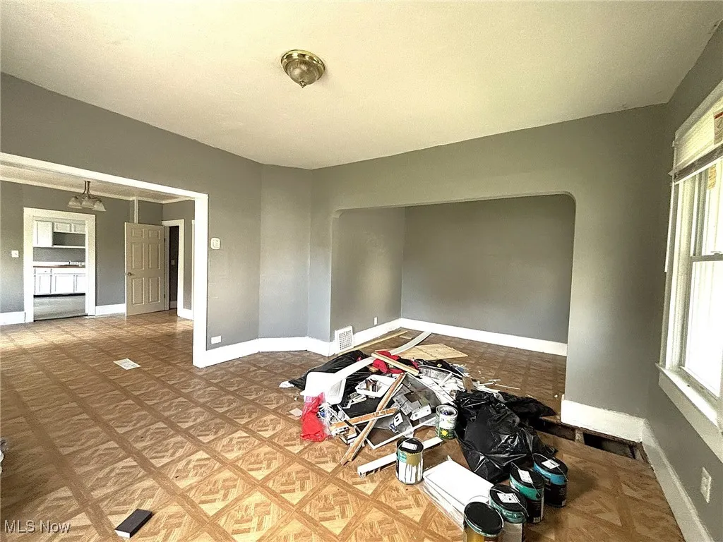 Unfurnished room with baseboards