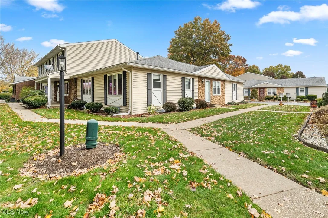 View of front of property featuring a front yard and covered porch