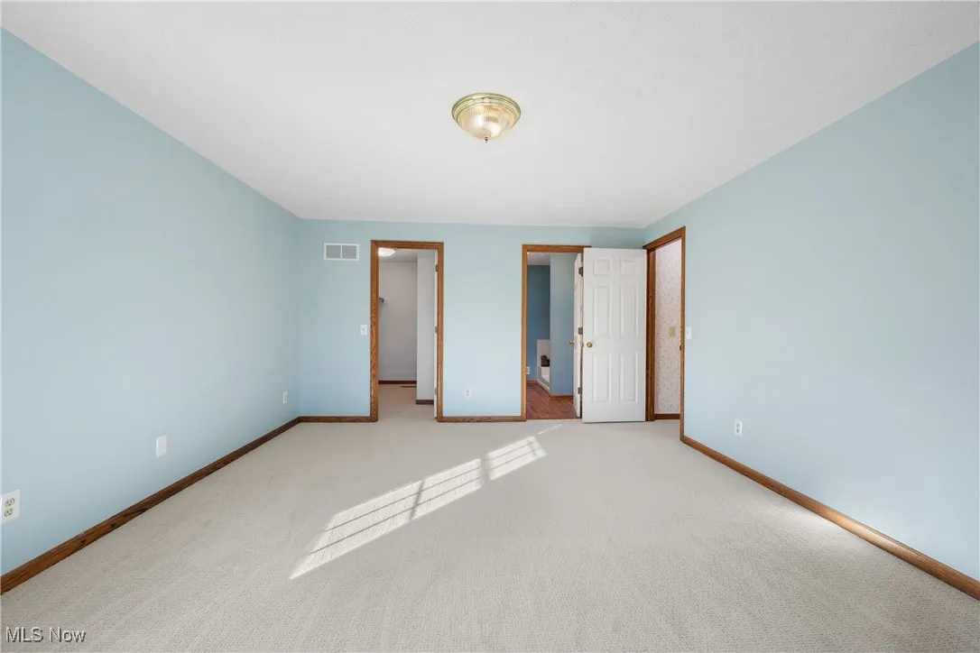 New carpeting continues into walk-in closet.  Ensuite bath