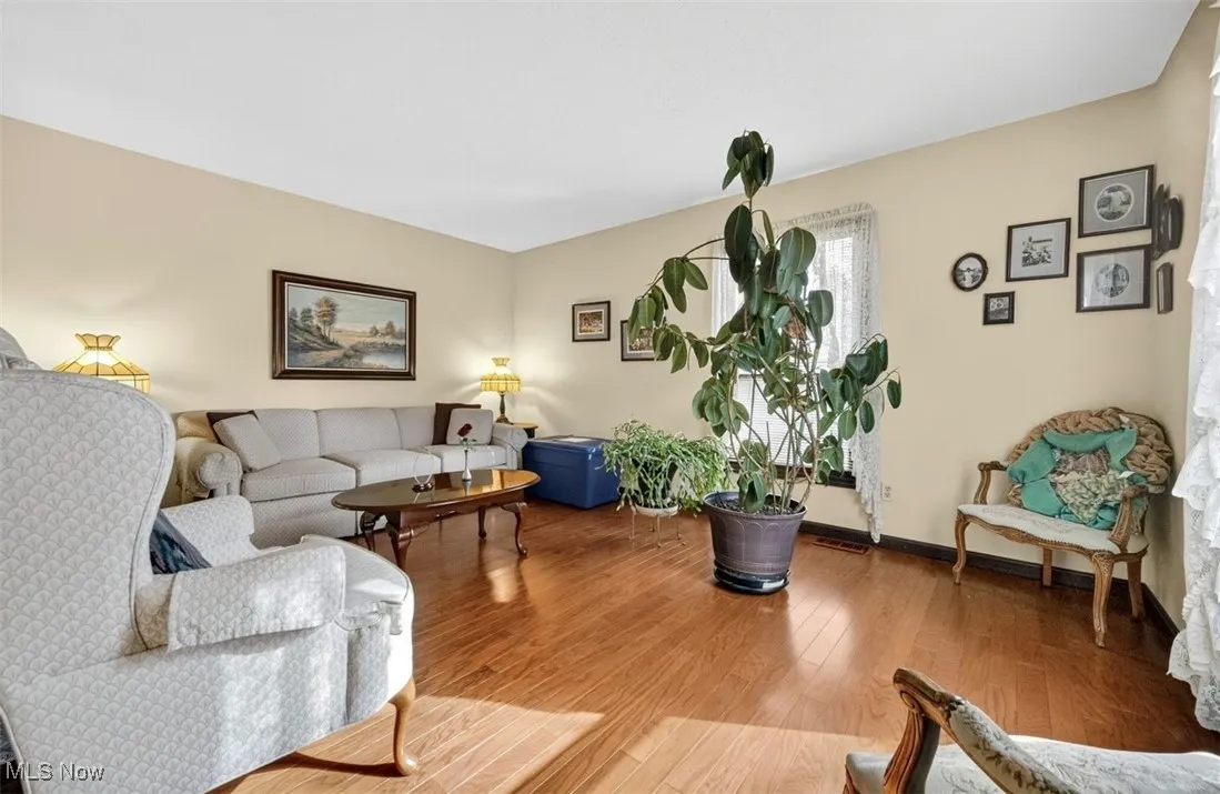 Living room featuring wood finished floors and baseboards