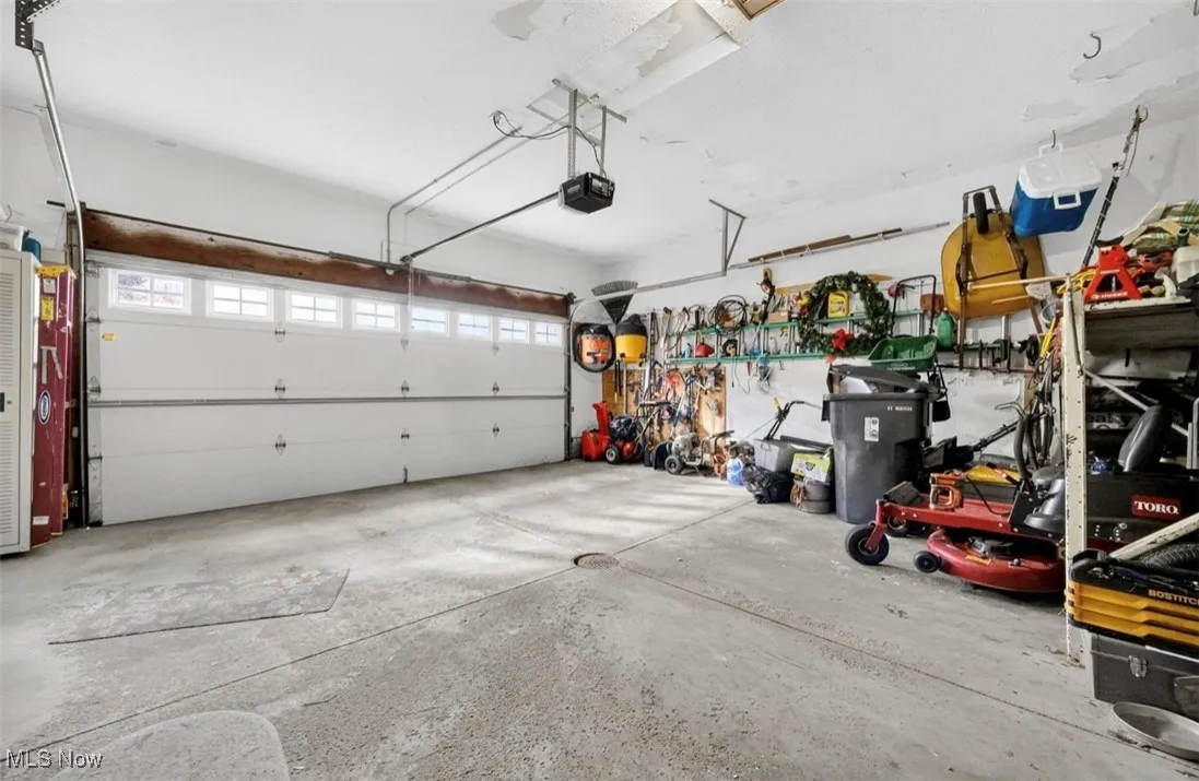 Garage featuring a garage door opener