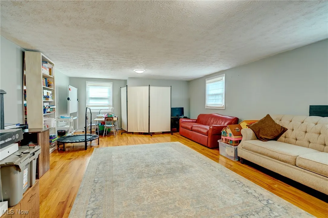 Dormer Bedroom with wood flooring