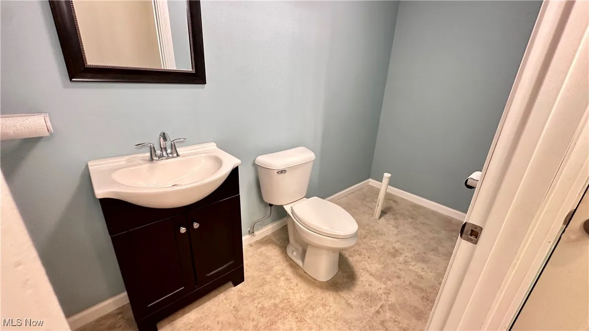 Bathroom with vanity and baseboards