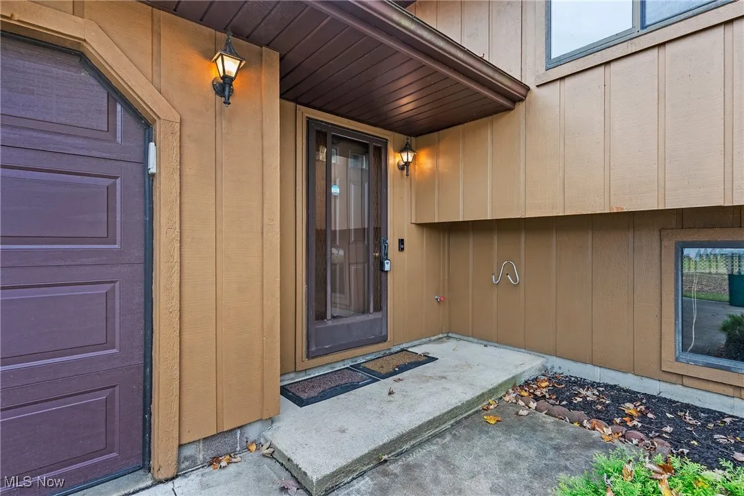 Entrance to property featuring board and batten siding