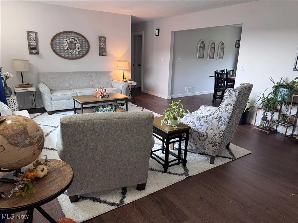 Living room featuring wood finished floors and baseboards