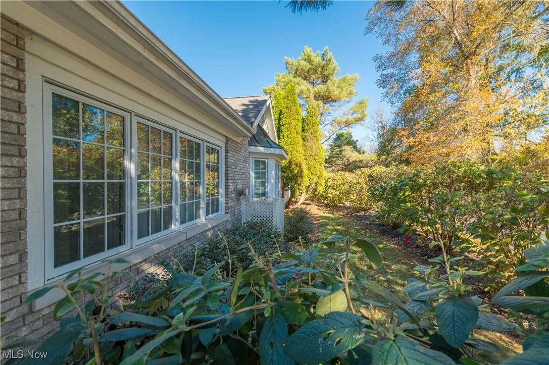 View of side of property featuring brick siding