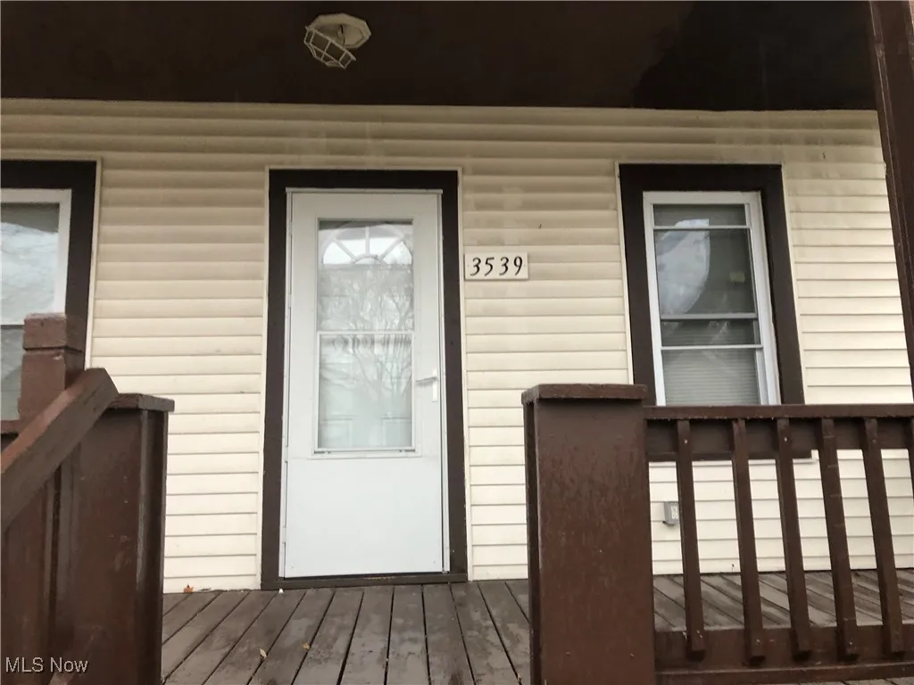 Entrance to property with a wooden deck