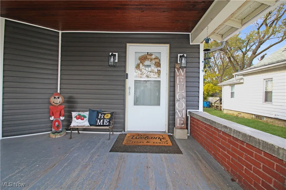 View of exterior entry featuring a porch