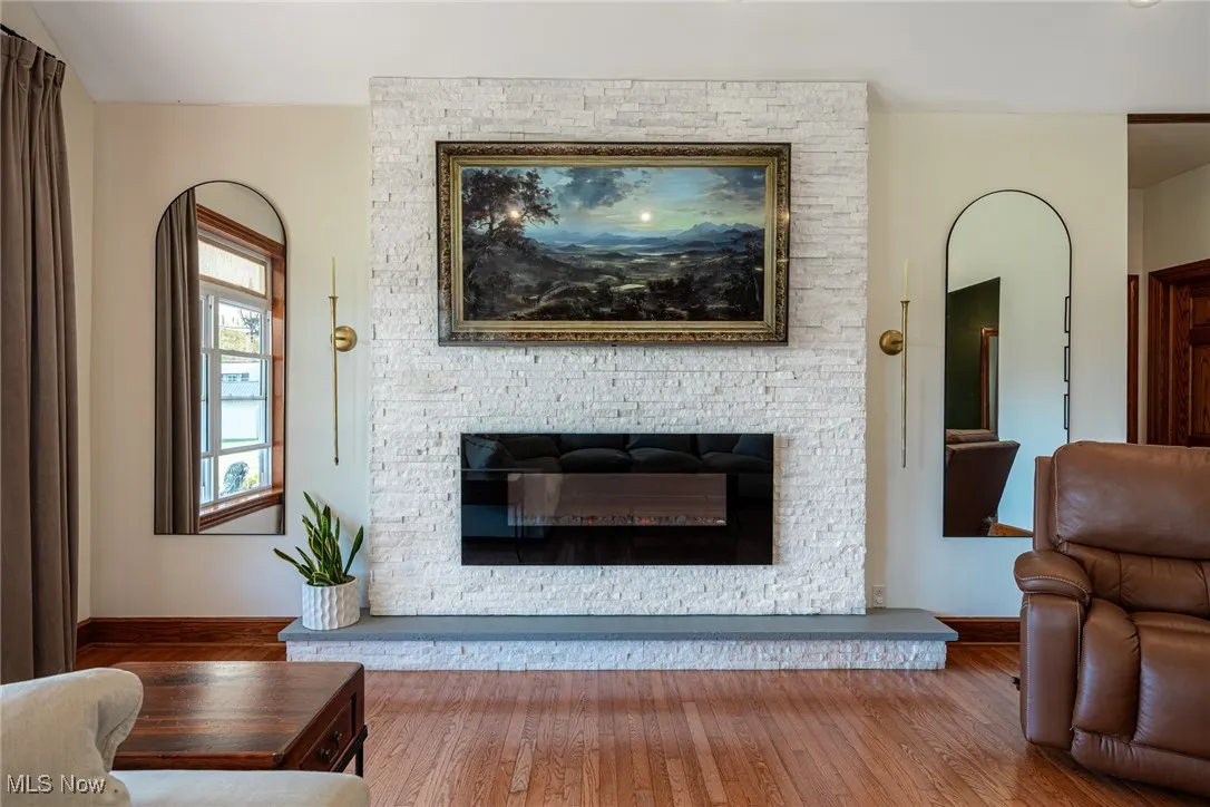 Living area featuring a fireplace and hardwood / wood-style floors