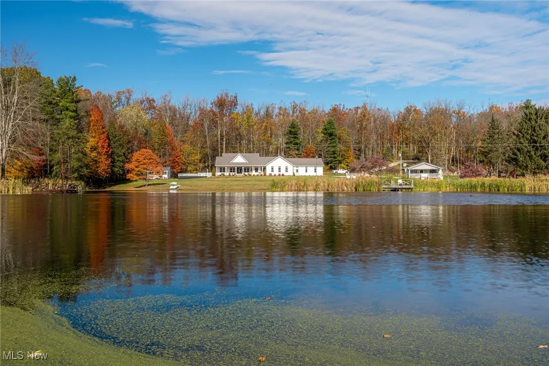 Water view featuring a heavily wooded area