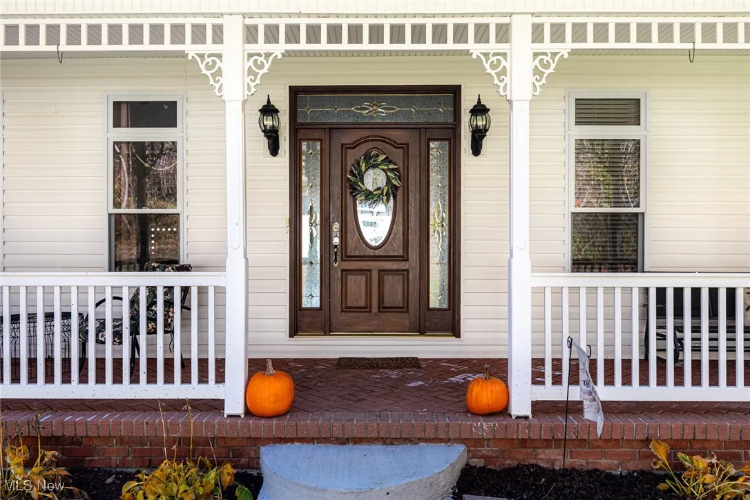 Property entrance with a porch