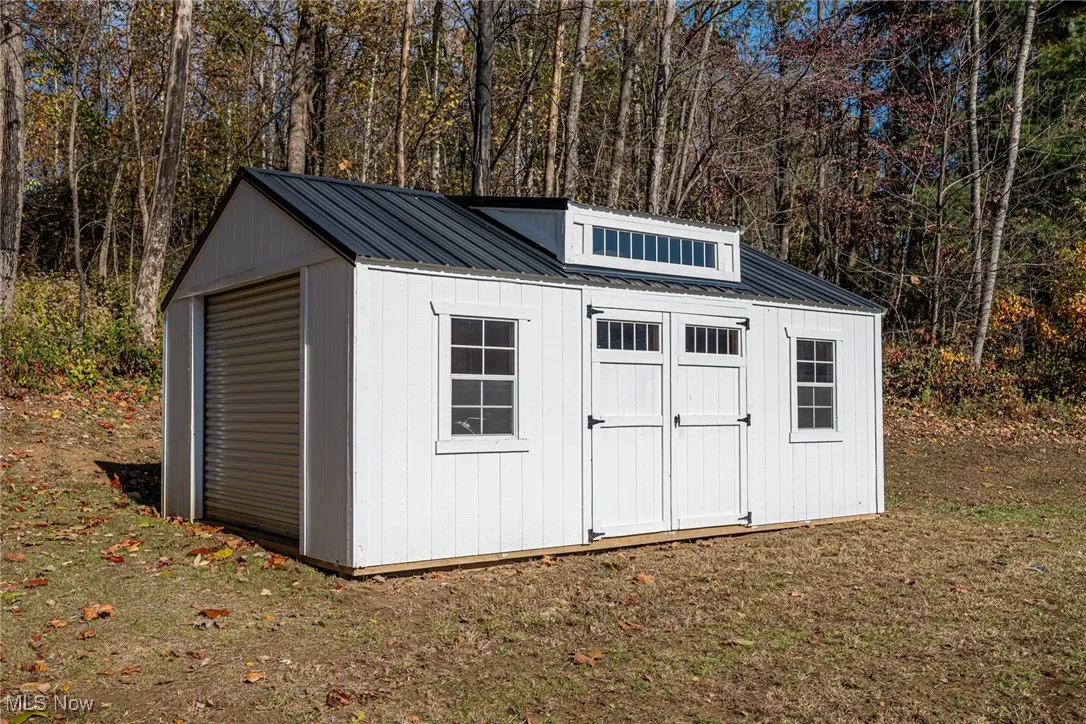 View of shed with a view of trees