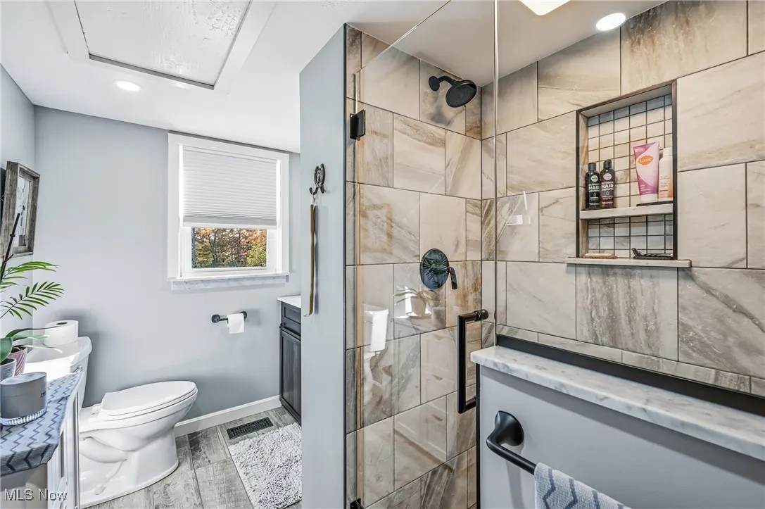 1st floor bathroom- newly updated with step in tiled shower, a spa like retreat.
